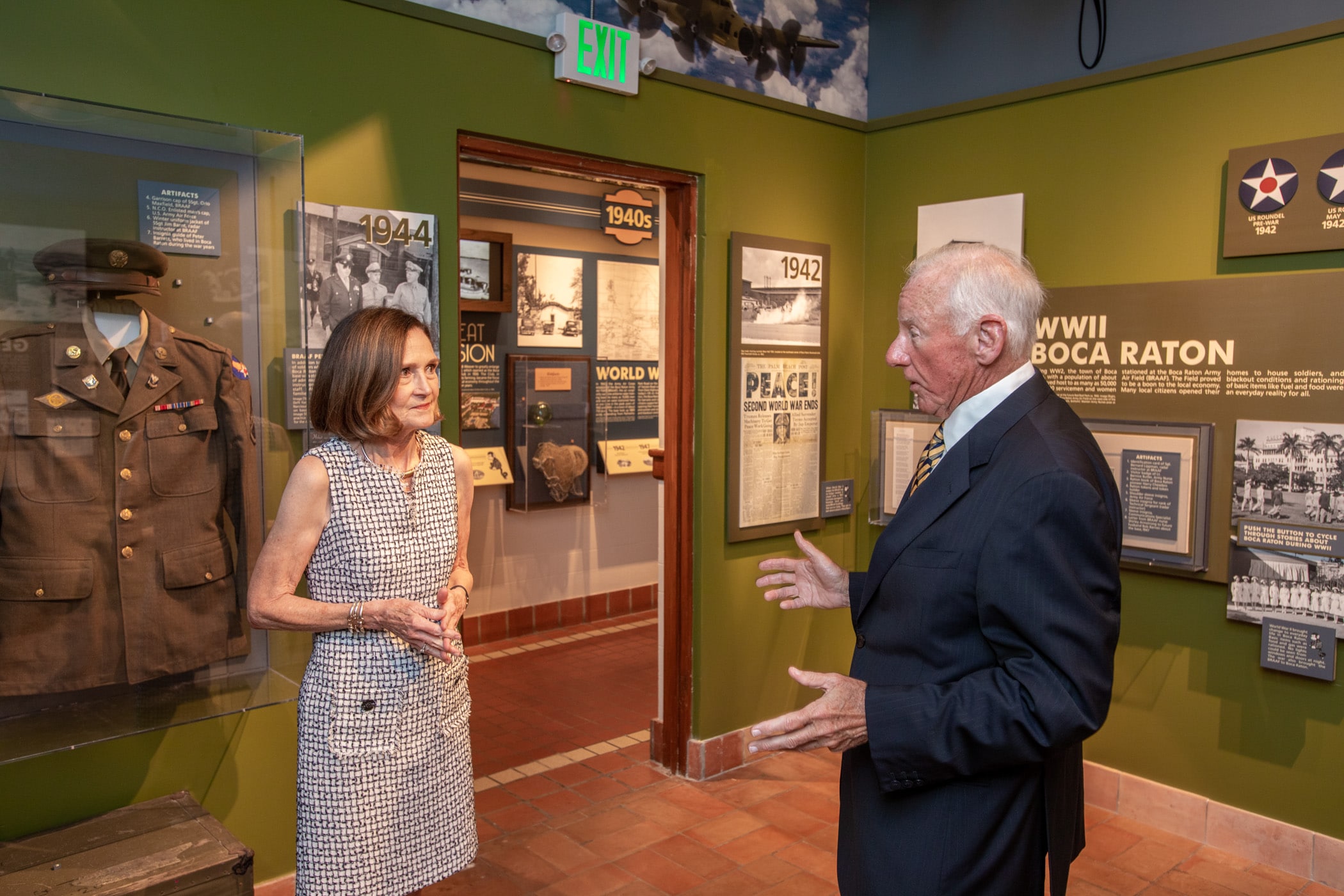 people converse inside The Boca Raton Historical Society and Museum