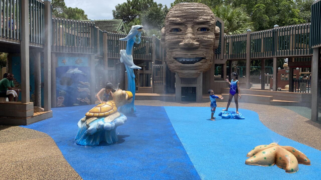 children play in sprinklers at Sugar Sand Park